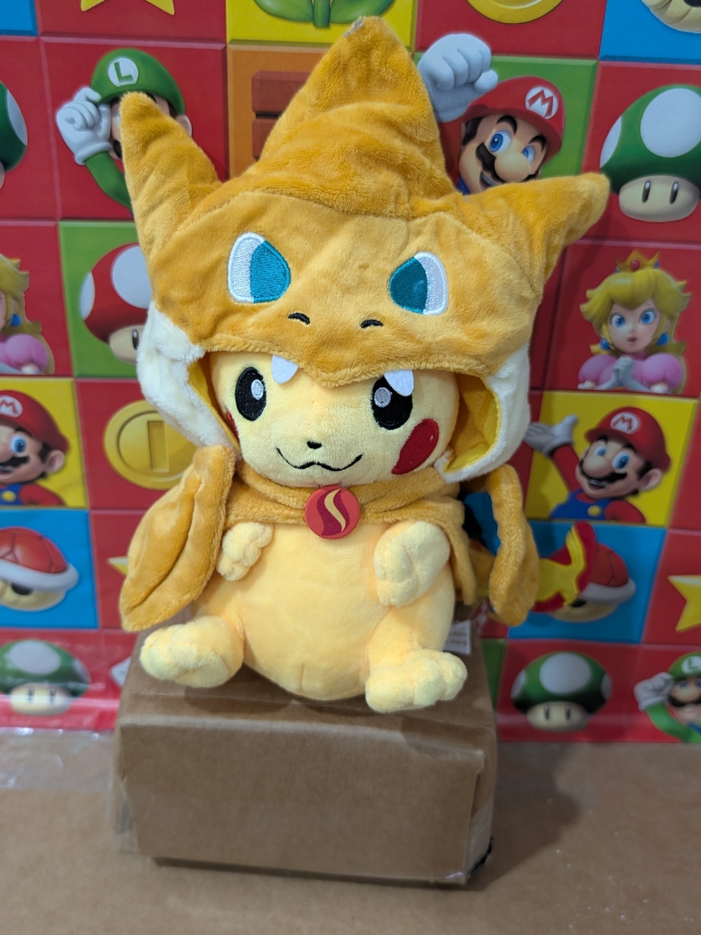 Pokemon Pikachu Plush in Orange Charizard Hood